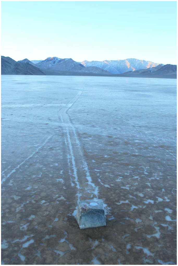 A rock with a GPS unit inside a cavity bored into its top[2]