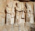 Taq-e Bostan - High-relief of Ardeshir II investiture.jpg