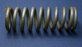A heavy-duty coil spring designed for compression and tension
