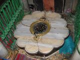 In the section of the cave which is a mosque, this grate allows visitors to look down into a shaft measuring 40 أقدام (12 متر), which leads to the ground level of the cave where Abraham and Sarah are buried