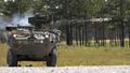 M1134 Anti-Tank Guided Missile Vehicle fires a BGM-71 TOW missile.