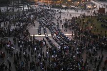 The demonstrators hope that a peaceful show of popular discontent could delegitimize Mubarak, who has been in power for 30 years under perpetually renewed "emergency laws." Above, Egyptians pray in downtown Cairo as part of their protest