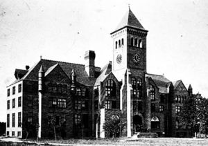 Early 20th century black-and-white photo of three-story building