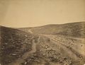 صورة "وادي ظل الموت" بالقرب من سڤاستوپول، صورها [[روجر فنتوني] في مارس 1855. It was so named by soldiers because of the number of cannonballs that landed there, falling short of their target, during the siege.[11]