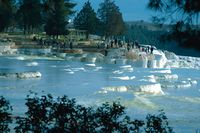 On emerging to the surface, the solution of calcium-carbonate in the spring water decomposes into carbon dioxide, calcium carbonate and water. The carbon dioxide is released into the air while the calcium carbonate separates off from the water to form a grayish-white limestone