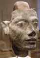 Granite head statue of Nefertiti. The securing post at head apex, allows for different hairstyles to adorn the head, Altes Museum, Berlin.