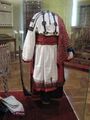 An example of Russian festive folk dress, including a rubakha (shirt), poneva (skirt), perednik (apron), and platok (shawl)