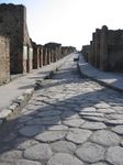 A street with ruined houses.