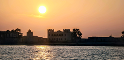 Alula and its historic castle during sunset.