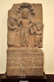 Image of a Nāga between two Nāgīs, inscribed in "the year 8 of Emperor Kanishka". 135 CE.[38][39][40]