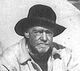 Bearded middle-aged man with a cowboy hat.