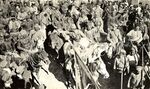 Assyrian General Agha Petros saluting his men after capturing Turkish soldiers and their banner