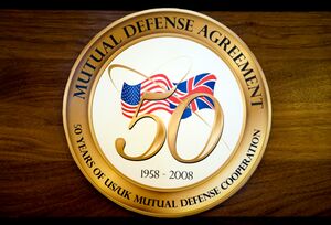 The logo contains the flags of the two countries overlaid with a stylised gold "50"