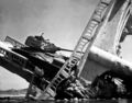 The wreckage of a bridge and North Korean Communist tank south of Suwon, Korea. The tank was caught on a bridge and put out of action by the U.S. Air Force. October 7, 1950.
