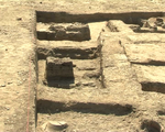 Archaeological site with remains of structures