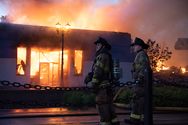 Firefighters observing the damage in Minneapolis the afternoon of May 28