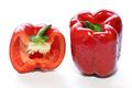 A whole and halved red bell pepper