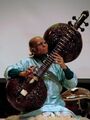 Rudra veena is a large plucked string instrument used in Hindustani classical music. One of the major types of veena played in Indian classical music, it has two calabash gourd resonators.[46] The vichitra veena, also with two large resonators, is a similar instrument.