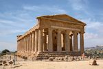 Ruins of a classical temple with columns.
