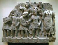 Kushan prince, said to be Huvishka, making a donation to a Boddhisattva.[48]