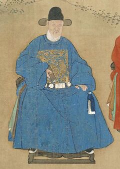 Li Dongyang seated on a chair, wearing a blue official robe with an embroidered rank badge and a black official hat.